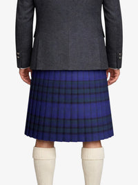 Person wearing a gray coat and blue plaid kilt on a white background