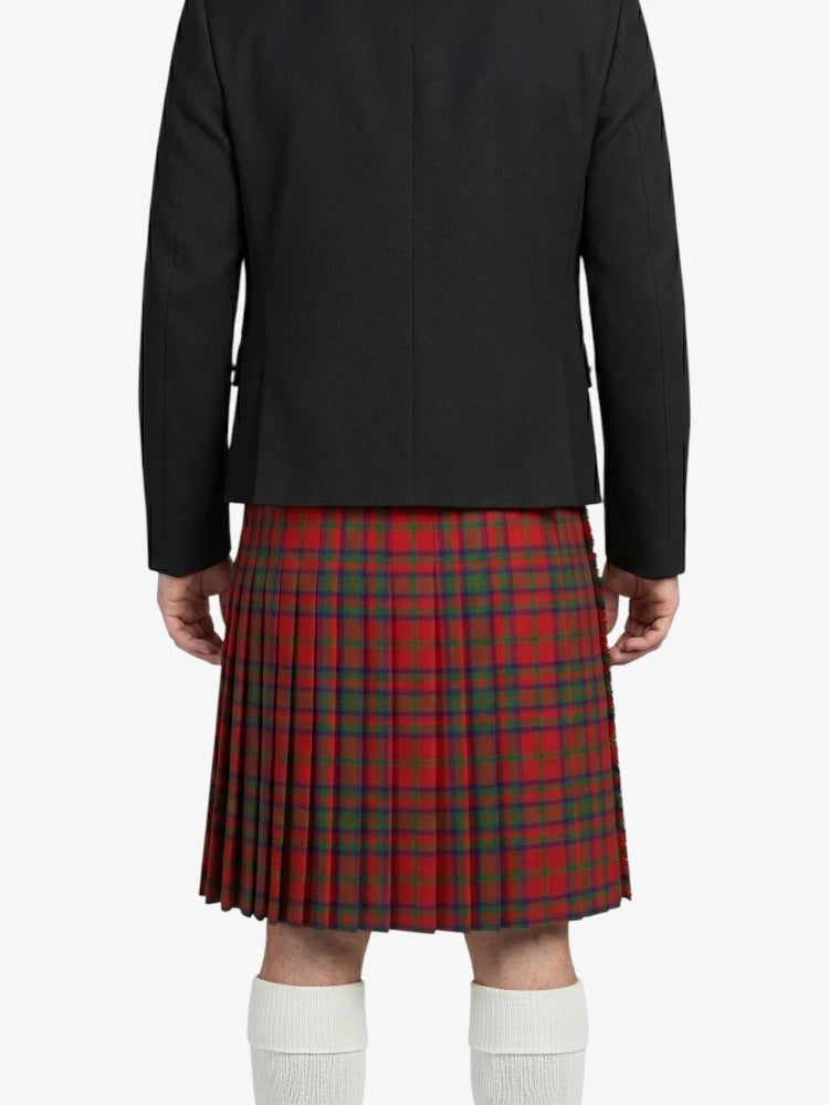 Person wearing a black jacket and red plaid kilt on a white background