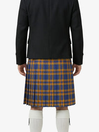 Person wearing a black jacket and blue and orange plaid kilt on a white background