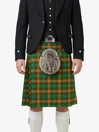 Person wearing a traditional Scottish kilt with a tartan pattern on a white background