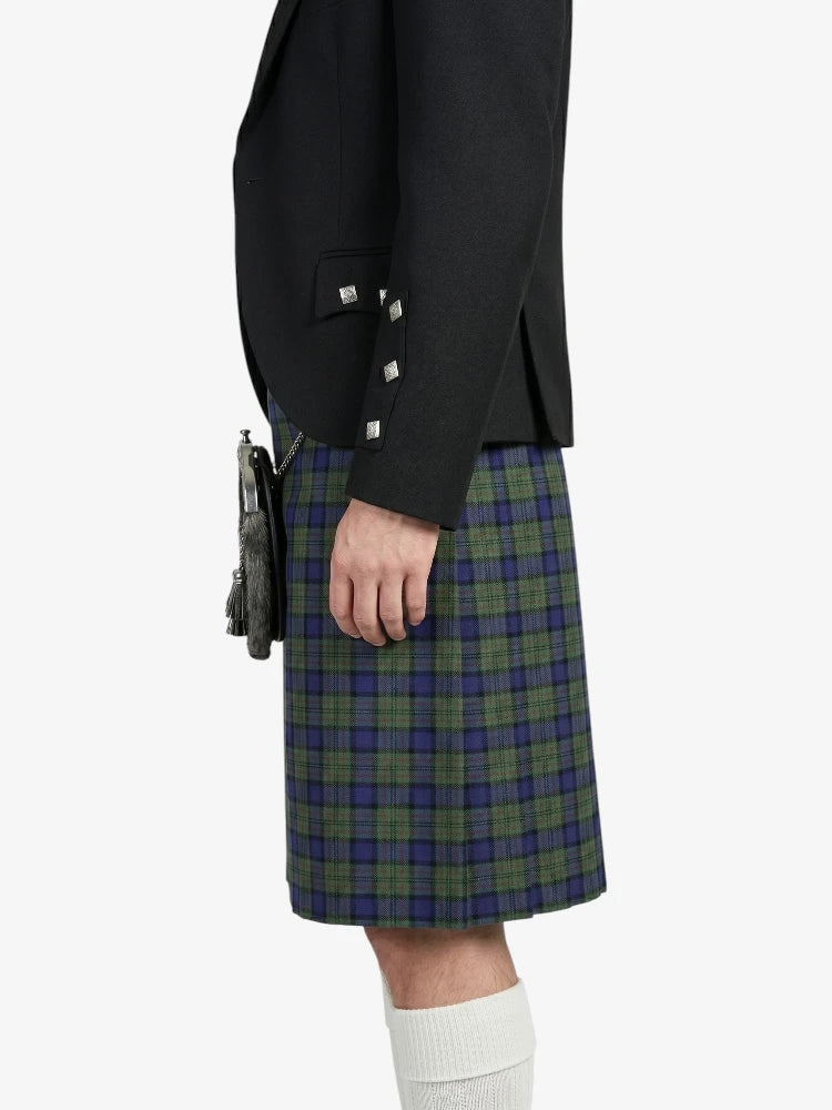 Person wearing a black jacket and green plaid kilt on a white background