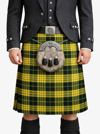 Person wearing a yellow and green plaid kilt with a gray jacket on a white background