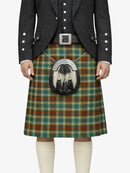 Person wearing a traditional Scottish kilt with a tartan pattern on a white background