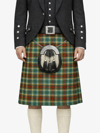 Person wearing a traditional Scottish kilt with a tartan pattern on a white background
