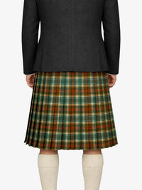 Person wearing a dark blazer and plaid kilt on a white background