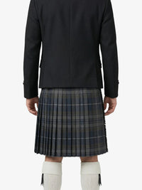 Person wearing a black jacket and plaid kilt on a white background