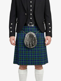 Person wearing a dark jacket and green plaid kilt with a silver sporran on a white background
