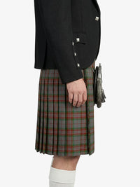 Person wearing a black jacket and plaid kilt on a white background