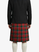 Person wearing a black coat and red plaid skirt on a white background