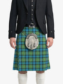 Person wearing a black jacket and green plaid kilt with a silver sporran on a white background