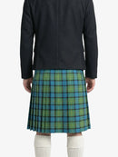 Person wearing a dark jacket and green plaid kilt on a white background