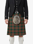 Person wearing a traditional Scottish kilt with a jacket on a white background
