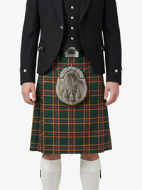Person wearing a traditional Scottish kilt with a jacket on a white background