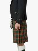 Person wearing a black jacket and green plaid kilt on a white background