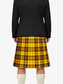Person wearing a black jacket and yellow plaid kilt on a white background