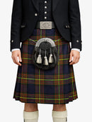 Person wearing a traditional Scottish kilt with a sporran on a white background