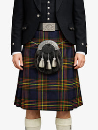 Person wearing a traditional Scottish kilt with a sporran on a white background