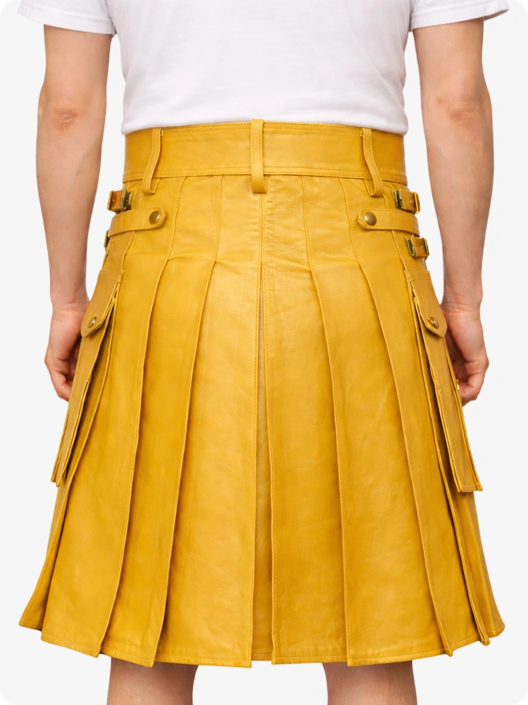 Yellow pleated skirt worn by a person on a white background