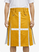 Person wearing a mustard yellow skirt with white accents on a white background