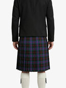 Person wearing a black jacket and plaid kilt on a white background