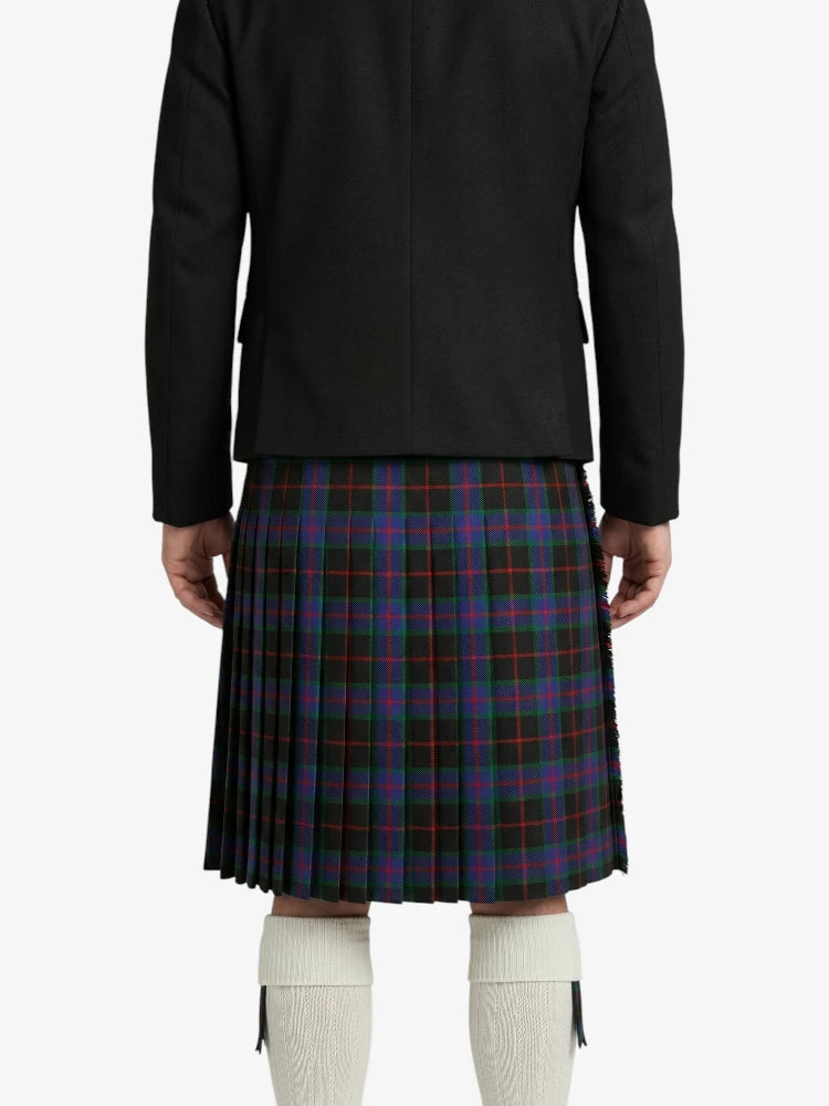 Person wearing a black jacket and plaid kilt on a white background