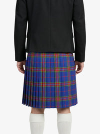 Person wearing a black jacket and blue plaid kilt on a white background