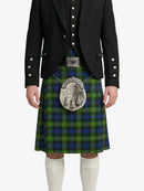 Person wearing a black jacket, green plaid kilt, and white socks on a white background