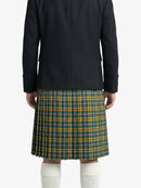Person wearing a black coat and green plaid kilt on a white background