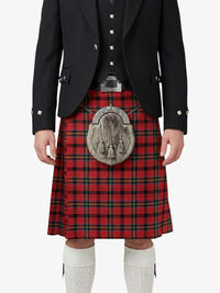Person wearing a red tartan kilt with a black jacket on a white background
