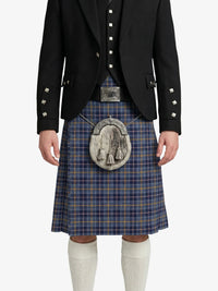 Person wearing a traditional Scottish kilt with a black jacket on a white background
