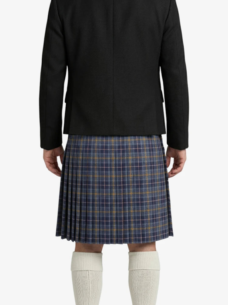 Person wearing a black jacket and plaid kilt on a white background