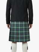 Person wearing a black jacket and green plaid kilt on a white background