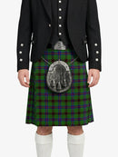 Person wearing a black jacket and green plaid kilt with a silver sporran on a white background