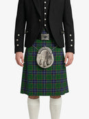 Person wearing a black jacket and green plaid kilt with a silver sporran on a white background