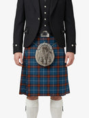 Person wearing a traditional Scottish kilt with a sporran on a white background