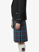 Person wearing a black jacket and blue plaid kilt on a white background