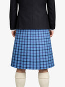 Person wearing a black jacket and blue plaid kilt on a white background