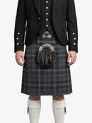 Person wearing a traditional Scottish kilt with a sporran on a white background