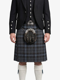 Person wearing a traditional Scottish kilt with a sporran on a white background