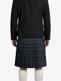 Person wearing a black jacket and plaid kilt on a white background