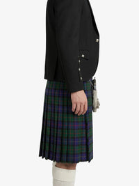 Person wearing a black jacket and plaid kilt on a white background
