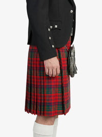 Person wearing a red tartan kilt with a black jacket on a white background