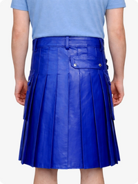 Person wearing a royal blue pleated skirt on a white background