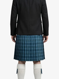 Person wearing a black jacket and blue plaid kilt on a white background
