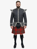 Man wearing a dark gray jacket with white accents and a royal stewart tartan kilt on a white background
