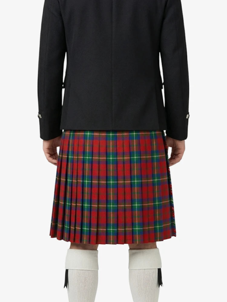 Person wearing a black jacket and red plaid kilt on a white background