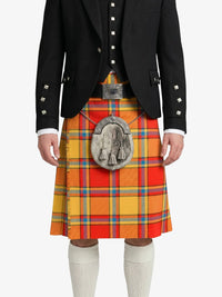 Person wearing a traditional Scottish kilt with a tartan pattern on a white background