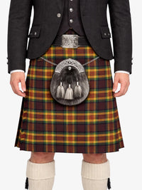 Person wearing a traditional Scottish kilt with a tartan pattern, jacket, and white knee-high socks.