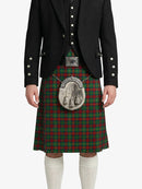 Person wearing a traditional Scottish kilt with a prominent tartan pattern on a white background