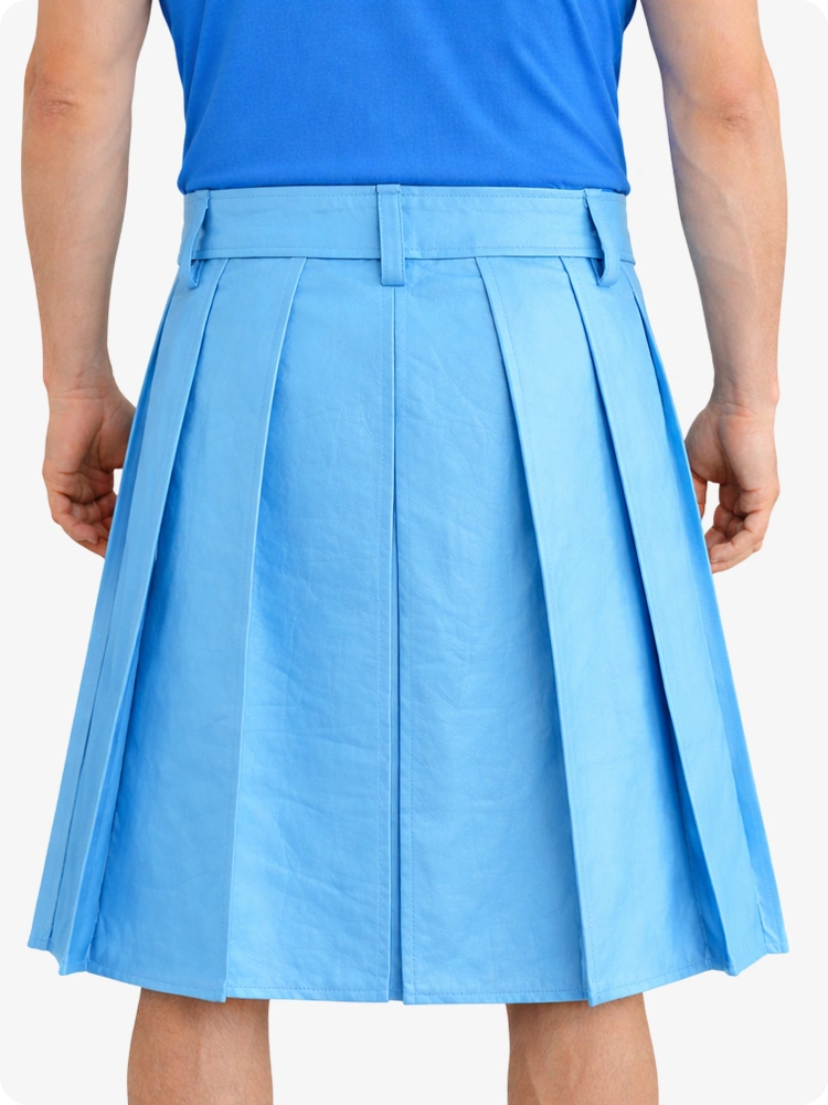 Person wearing a SKy blue pleated skirt and blue top on a white background